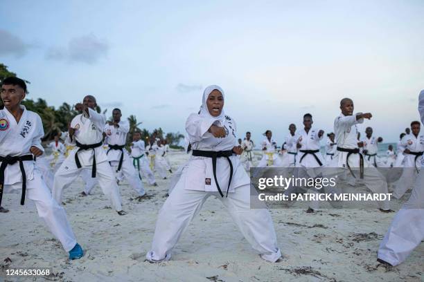 Athletes perform at a beach exhibition ahead of the 10th Mombasa Open Tong-IL Moo-Doo International Martial Arts Championship 2022, in Mombasa,...