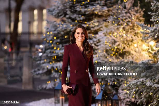 Britain's Catherine, Princess of Wales arrives to attend the "Together At Christmas Carol Service" at Westminster Abbey, in London, on December 15,...