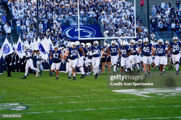 The Penn State Nittany Lions run onto the field prior to the college football game between the Michigan State Spartans and Penn State Nittany Lions...