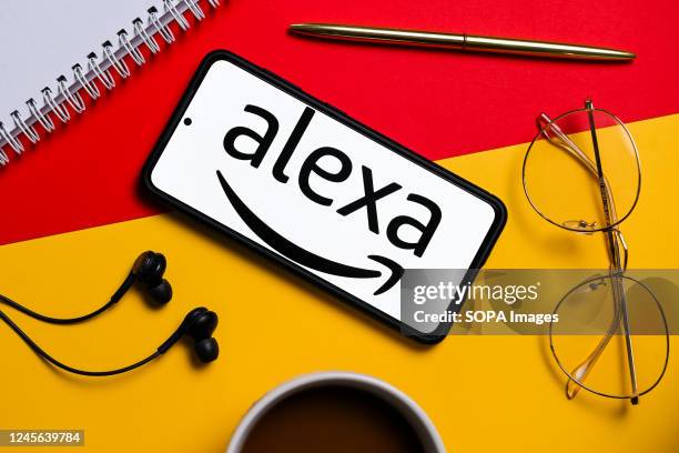 In this photo illustration an Amazon Alexa logo seen displayed on a smartphone.