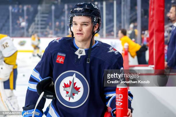 Karson Kuhlman of the Winnipeg Jets looks on during the pre-game warm up prior to NHL action against the Nashville Predators at the Canada Life...