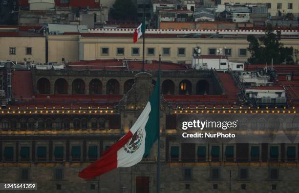 The national flag of Mexico flies in Constitution Square near the National Palace in Mexico City. Mexico, Thursday, December 15, 2022.