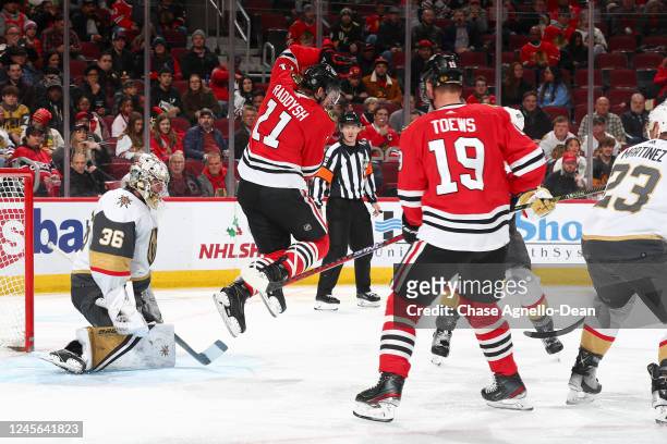 Taylor Raddysh of the Chicago Blackhawks jumps in front of goalie Logan Thompson of the Vegas Golden Knights in the second period at United Center on...