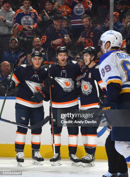 Zach Hyman of the Edmonton Oilers celebrates his first period goal against the St. Louis Blues with teammates Tyson Barrie and Ryan Nugent-Hopkins...