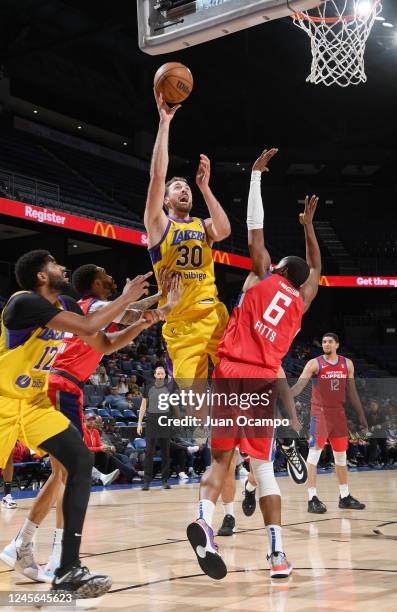 Jay Huff of the South Bay Lakers goes to the basket against Malik Fitts of the Ontario Clippers on December 15, 2022 at Toyota Arena in Ontario,...