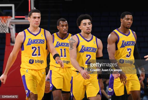 Cole Swider, Fabian White Jr. #11, Scotty Pippen Jr. #2 and Shaquille Harrison of the South Bay Lakers walk back to the bench during a time out in...