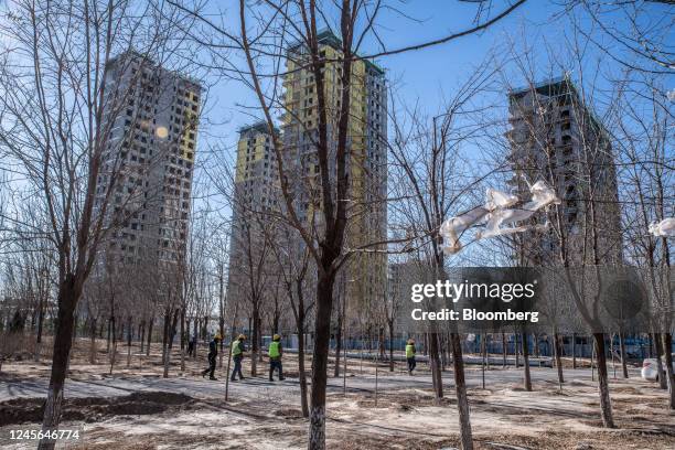 Residential buildings under construction at the Honor of China project, originally developed by defaulted Shimao Group Holdings Ltd. Before sold to...