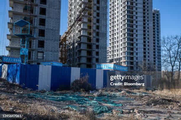 Residential buildings under construction at the Honor of China project, originally developed by defaulted Shimao Group Holdings Ltd. Before sold to...