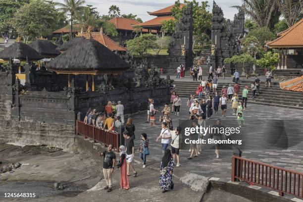 Visitors in Tanah Lot, Bali, Indonesia, on Wednesday, Dec. 14, 2022. Tourist arrivals in Indonesia are expected to increase significantly from an...