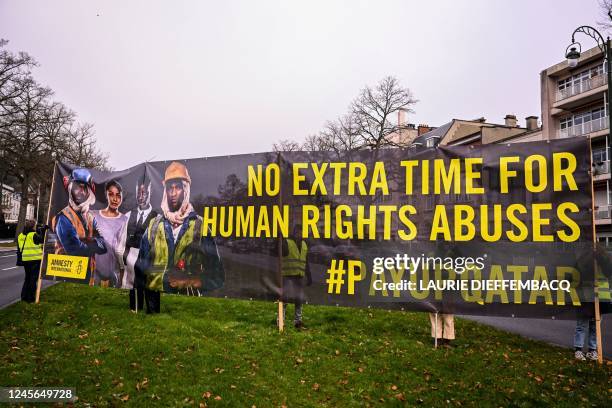 Illustration picture shows a protest of Amnesty International outside the Qatari embassy on International Migrants Day, in Brussels, Friday 16...