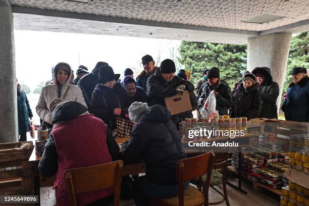 People waiting in line to collect humanitarian aid in the village of Chornobaivka, a suburban village in Kherson Raion, Kherson,Ukraine, on December...