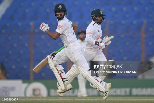 Bangladesh's Najmul Hossain Shanto and Zakir Hasan run between the wickets during the third day of the first cricket Test match between Bangladesh...