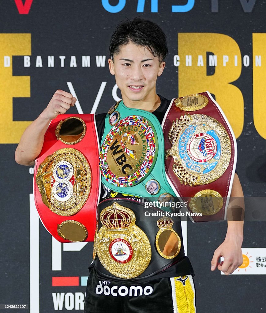 Japan's Naoya Inoue poses with his four champion belts after... News ...