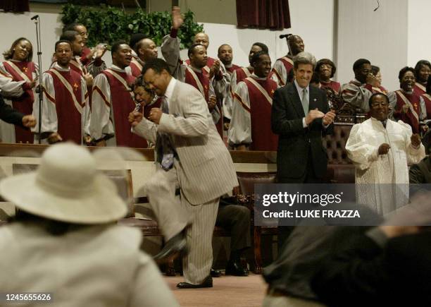 Democratic presidential candidate and US Senator John Kerry of Massachusetts attends Sunday service beside beside Pastor Bishop Phillip Coleman at...