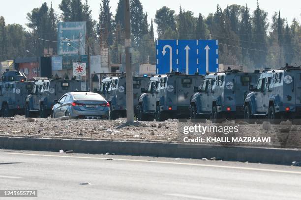 Jordanian security forces deploy their armoured vehicles in the southern city of Maan, some 220 kms south of the capital Amman, on December 16, 2022...