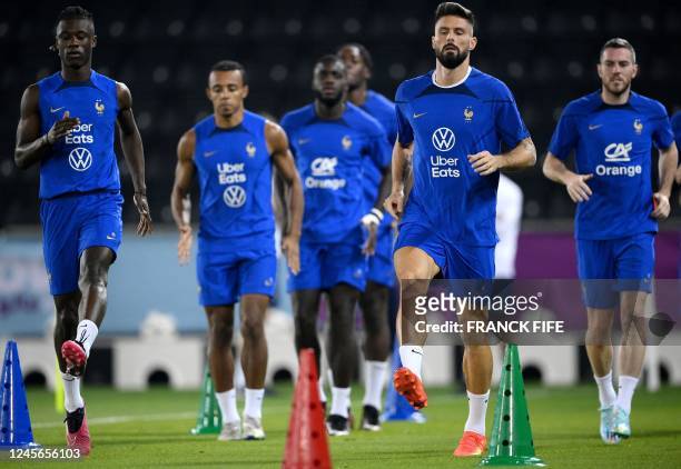 France's midfielder Eduardo Camavinga, France's defender Jules Kounde, France's defender Dayot Upamecano, France's forward Olivier Giroud and...