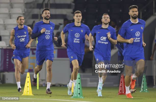 Players of France attend a training session ahead of the 2022 FIFA World Cup Final Match against Argentina, at Al Sadd SC Academy Training Fields in...