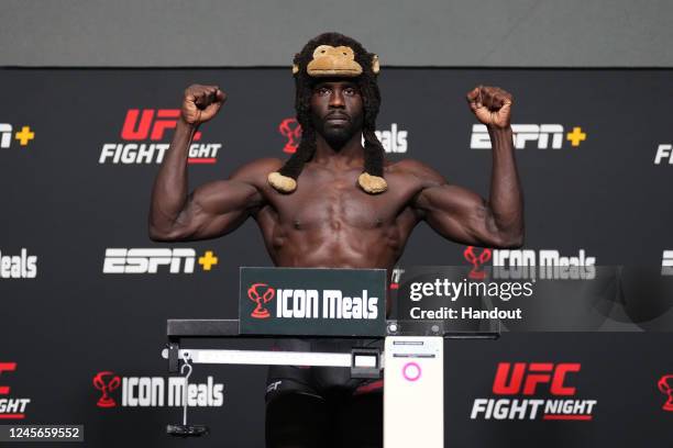 In this UFC handout, Jared Cannonier poses on the scale during the UFC Fight Night weigh-in at UFC APEX on December 16, 2022 in Las Vegas, Nevada.