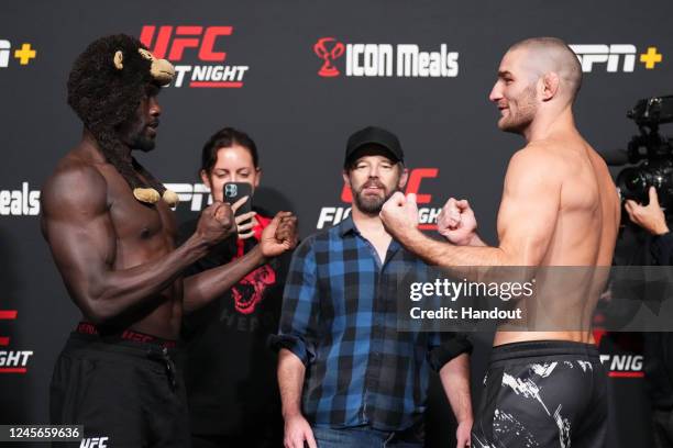 In this UFC handout, Jared Cannonier and Sean Strickland face off during the UFC Fight Night weigh-in at UFC APEX on December 16, 2022 in Las Vegas,...