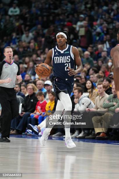 Frank Ntilikina of the Dallas Mavericks dribbles the ball during the game against the Portland Trail Blazers on December 16, 2022 at the American...