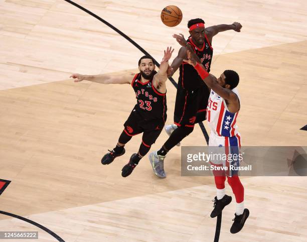 Toronto Raptors guard Fred VanVleet and Toronto Raptors forward Pascal Siakam try to defend a Brooklyn Nets guard Kyrie Irving buzzer beater to win...