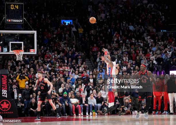 Kyrie Irving of the Brooklyn Nets shoots a game winning shot to defeat the Toronto Raptors during the second half of their basketball game at the...