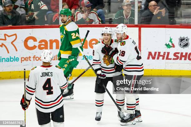 Jonathan Toews of the Chicago Blackhawks celebrates his power play goal against the Minnesota Wild with teammate Patrick Kane in the third period of...