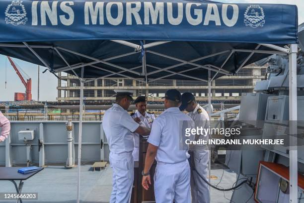 In this photograph taken on on December 15, 2022 sailors interact on board the second stealth guided missile destroyer of Project 15B, Mormugao of...