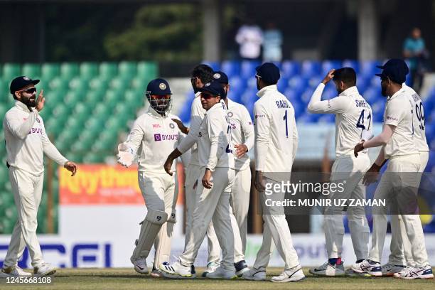 Indias cricketers celebrate after the dismissal of Bangladesh's Yasir Ali during the fourth day of the first cricket Test match between Bangladesh...
