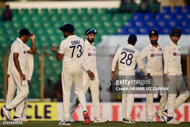 Indias cricketers walk off the field at the end of the fourth day of the first cricket Test match between Bangladesh and India at the Zahur Ahmed...