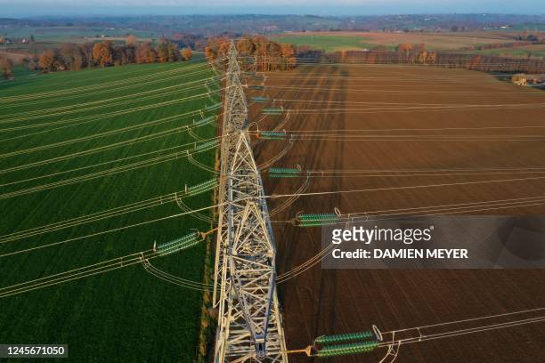 Photograph shows an aerial view of electric pylons in the countryside of Saint-Laurent-de-Terregatte, western France on December 6, 2022. - France...