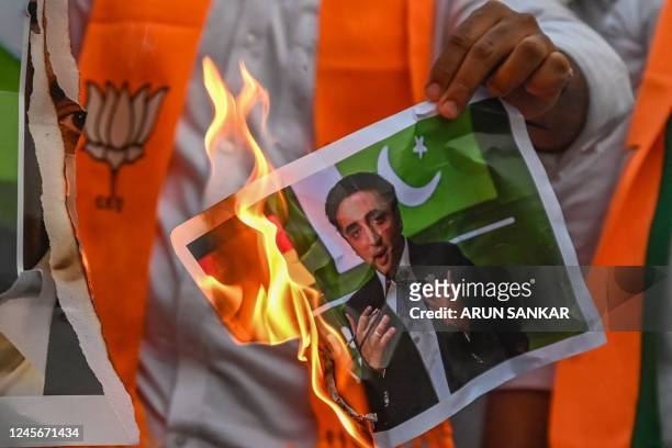 Activists from Bharatiya Janata Yuva Morcha shout slogans and burn a portrait of Pakistani foreign minister Bilawal Bhutto Zardari's over his remarks...