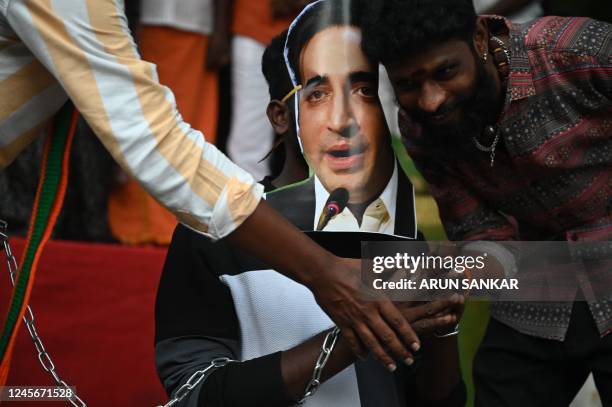 Activists from Bharatiya Janata Yuva Morcha shout slogans and prepare to burn a portrait of Pakistani foreign minister Bilawal Bhutto Zardari's over...