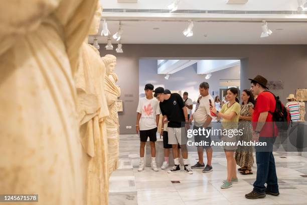 Tourists exploring the archaeological museum of Heraklion in Crete that hold the most important and complete collection of the Minoan civilisation of...