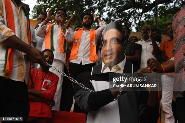 Activists from Bharatiya Janata Yuva Morcha shout slogans and prepare to burn a portrait of Pakistani foreign minister Bilawal Bhutto Zardari's over...