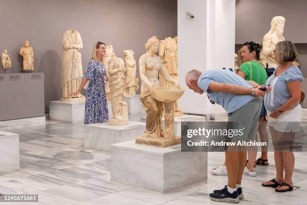 Tourists exploring the archaeological museum of Heraklion in Crete that hold the most important and complete collection of the Minoan civilisation of...