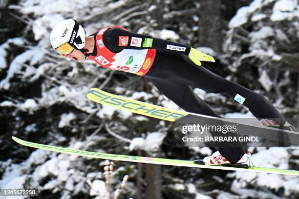 France's Laurent Muhlethaler reacts as he competes during the Individual Gundersen Normal Hill 10km competition of the Men's FIS Nordic Combined...