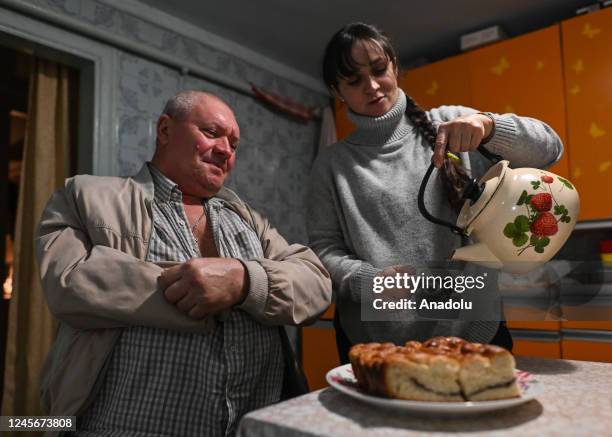 Olesya having a cup of tea with her husband Oleg after she completed her rounds of family and friends houses who have temporarily left home, in...