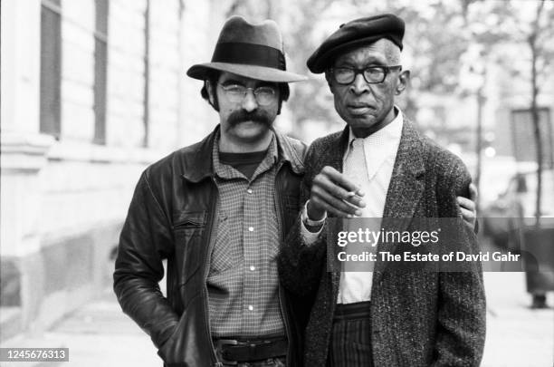 Blues and ragtime guitarist and singer Roy Book Binder and legendary country blues guitarist and singer Pinkney 'Pink' Anderson pose for a portrait...