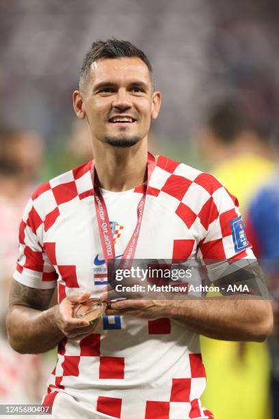 Dejan Lovren of Croatia celebrates at full time with his FIFA World Cup third place medal during the FIFA World Cup Qatar 2022 3rd Place match...