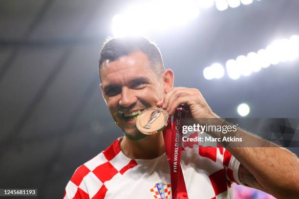 Dejan Lovren of Croatia poses with his 3rd place medal during the FIFA World Cup Qatar 2022 3rd Place match between Croatia and Morocco at Khalifa...