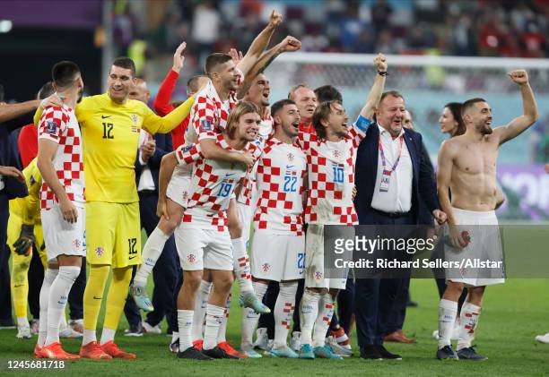Martin Erlic, Ivo Grbic, Borna Sosa; Dejan Lovren, Josip Juranovic, Luka Modric, Mateo Kovacic of Croatia celebrate after the FIFA World Cup Qatar...