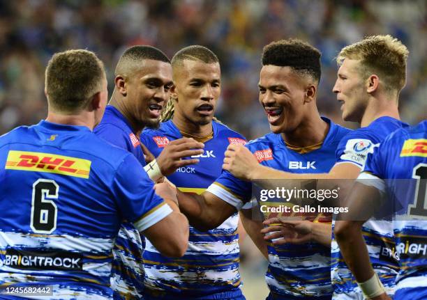 Leolin Zas of DHL Stormers celebrates scoring a try with teammates during the Heineken Champions Cup match between DHL Stormers and London Irish at...