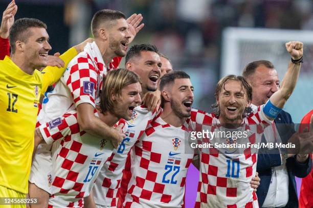 Ivo Grbic, Borna Sosa, Dejan Lovren, Josip Juranovic and Luka Modric of Croatia celebrates after the FIFA World Cup Qatar 2022 3rd Place match...