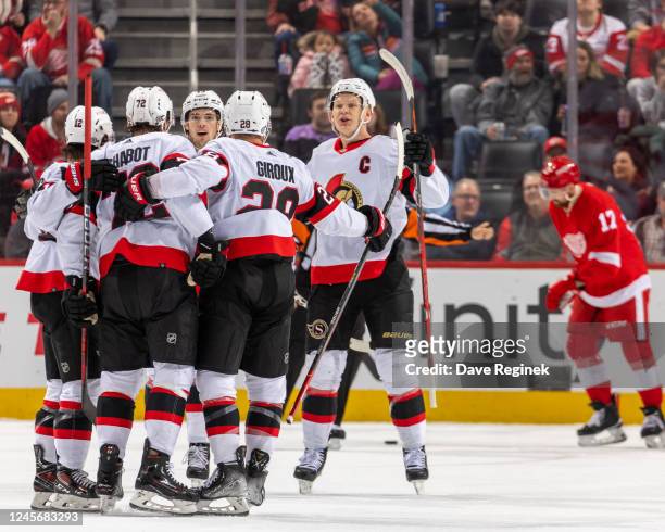 Thomas Chabot of the Ottawa Senators celebrates a goal with teammates during the first period of an NHL game against the Detroit Red Wings at Little...