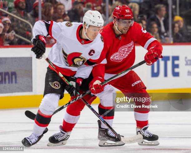 David Perron of the Detroit Red Wings battles for position with Brady Tkachuk of the Ottawa Senators during the first period of an NHL game at Little...