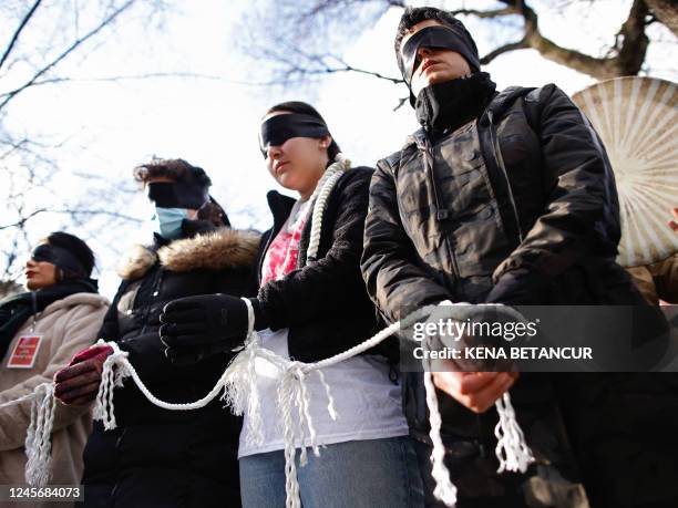 People protest against executions and detentions in Iran, in front of the Iranian Permanent Mission to the UN in New York City on December 17, 2022.