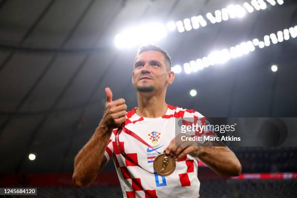 Dejan Lovren of Croatia poses with his 3rd place medal during the FIFA World Cup Qatar 2022 3rd Place match between Croatia and Morocco at Khalifa...