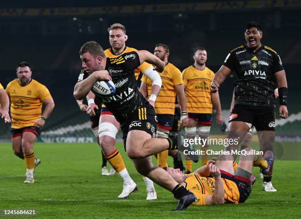 Pierre Bourgarit of La Rochelle scores his sides third try during the Champions Cup game versus Ulster at Aviva Stadium on December 17, 2022 in...