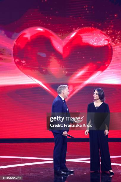 Johannes B. Kerner and Annalena Baerbock on stage during the "Ein Herz fuer Kinder" Gala at Studio Berlin Adlershof on December 17, 2022 in Berlin,...